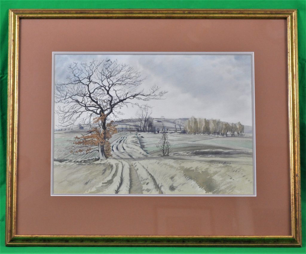 Framed watercolor of a winter landscape featuring a barren tree with a road wandering past it to the hills beyond.